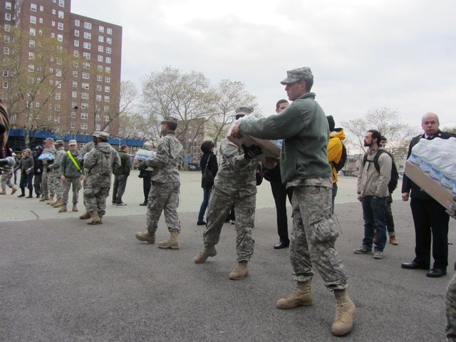 National Guard forming a bucket brigade to distribute supplies in Red Hook. 